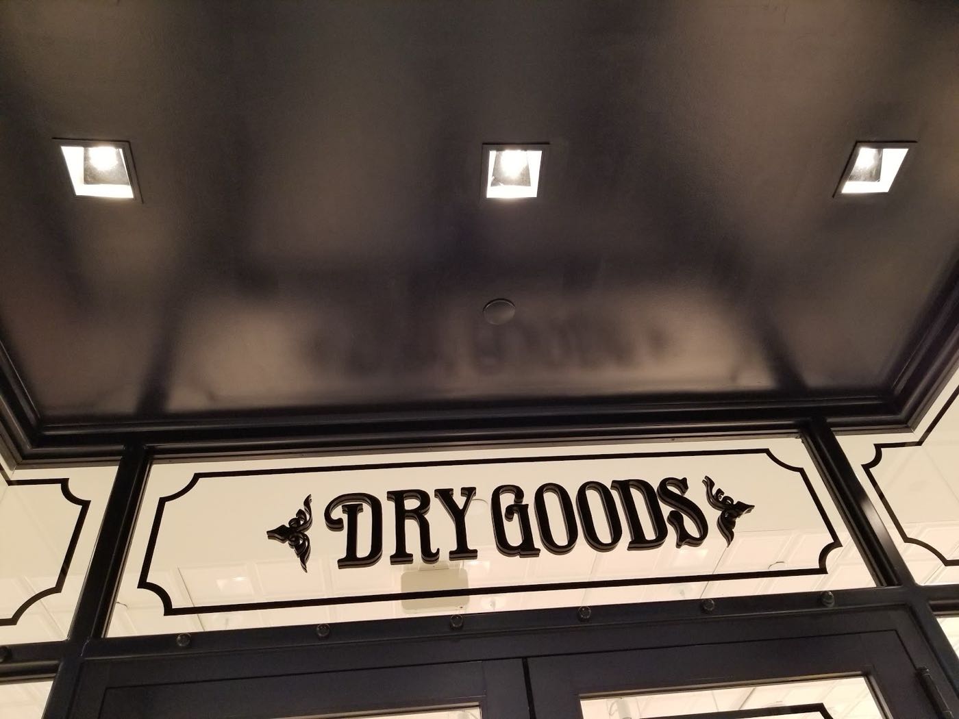 Black-painted storefront ceiling and millwork in a retail store